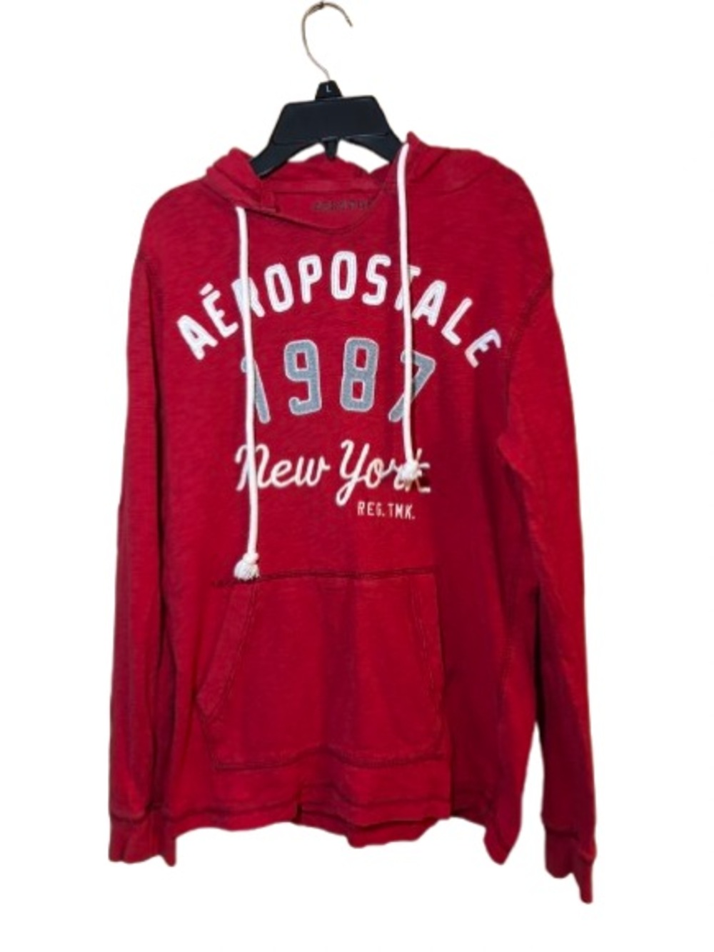 Red Aeropostale pullover hoodie features white drawstring cords and "New York"
